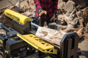 a person using a chainsaw to cut a piece of wood.
